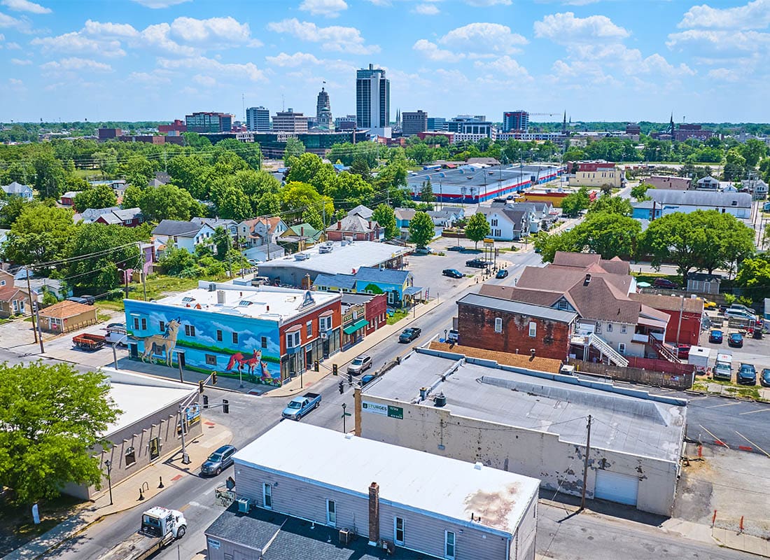 Fort Wayne, in - Aerial Near Downtown Fort Wayne With Distant Skyscrapers and Wells Street Fox and Wolf Mural